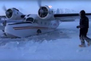 Grumman Goose seaplane in frozen water Alaska